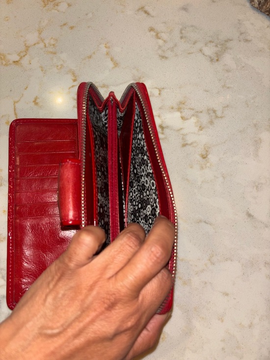 Brighton Red leather wallet featuring a decorative silver-toned snap closure. - Picture 8 of 16